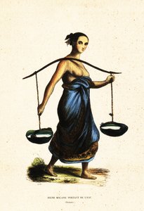 Jeune femme malaise portant des seaux d