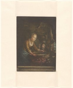 Jeune femme coupant des oignons