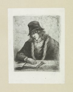 Homme lisant avec un chapeau