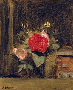 Bouquet de fleurs dans un verre à côté d