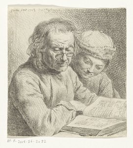 Homme et garçon lisant un livre