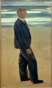 Jeune homme devant les vagues