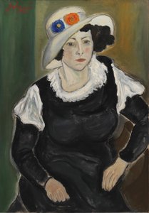 Une dame portant un chapeau. La femme de l