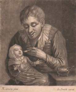 Homme nourrissant un enfant