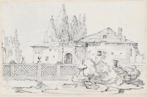 Maison et arbres à travers un mur de jardin