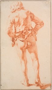 Un homme à moitié nu, marchant, vu de dos