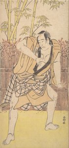 Le deuxième Ichikawa Komazo en homme debout dans une attitude dramatique - Katsukawa Shunko