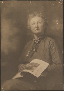 [Woman Holding Magazine]