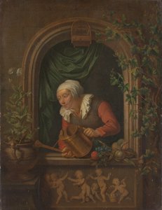 Femme arrosant une plante