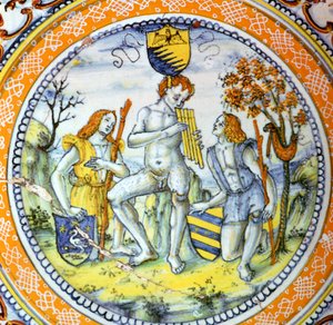 Assiette en terre cuite italienne montrant Pan jouant de la flûte à deux bergers - Maestro Benedetto