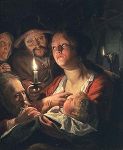 Mère et enfant à la lumière des bougies