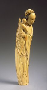 Figure de Guanyin tenant un enfant (ivoire sculpté)