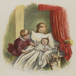 Jeune garçon et fille regardant un bébé