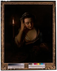 Une jeune fille lisant à la lumière d