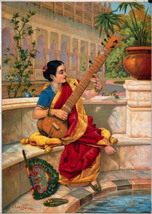Une femme indienne assise joue du sitar près d