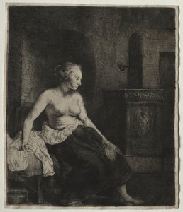Femme assise à moitié vêtue à côté d