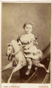 Jeune fille assise sur un cheval à bascule, 1860s - Robert H. Preston