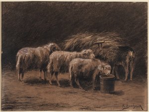 Un couple de moutons et un bélier dans une étable
