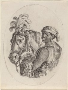 Palefrenier noir avec un cheval arabe