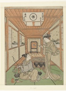 Jeune homme et jeune fille au stand de tir
