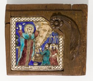 Un carreau de céramique syrien signé et daté, peint en manganèse, bleu et brun, daté 1699