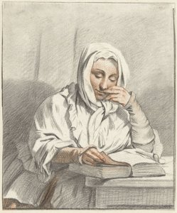 Jeune femme lisant à une table