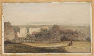 Un vaste bâtiment avec des dépendances agricoles et les ruines d