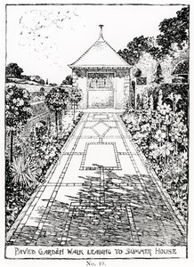 Promenade de jardin pavée menant à la maison d