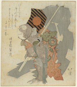 Singe dressé jouant avec des grelots et un gohei