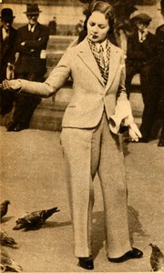 Une dame en pantalon nourrissant des pigeons à Trafalgar Square, 1933 - Unbekannt