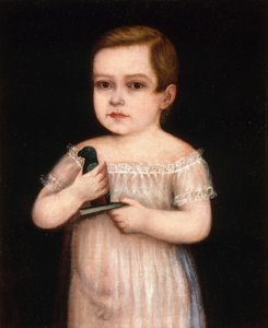 Enfant avec un perroquet jouet