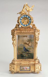 Pendule de cheminée, monture en porcelaine dorée, avec automate d