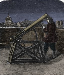 Isaac Newton (1642-1727) physicien anglais utilisant son télescope