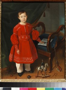 Portrait de petit garçon en robe rouge posant parmi ses jouets et un abécédaire - Unknown artist