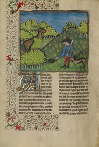 Un chasseur et un chien examinant la trace d