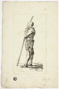Homme en armure tenant un bâton