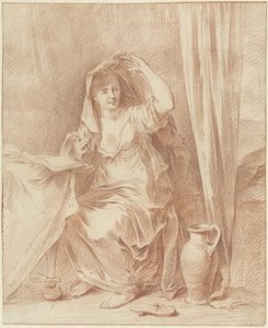 Femme assise à une table avec un livre