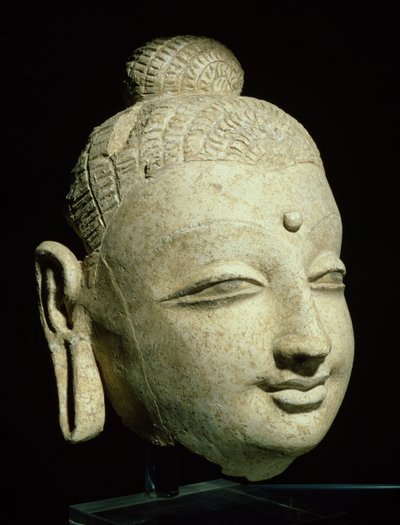 Tête de Bouddha souriant, style gréco-bouddhiste, d