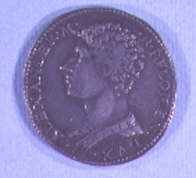 Pièce de monnaie décorée de la tête d