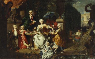 Groupe familial sur une terrasse dans les jardins d