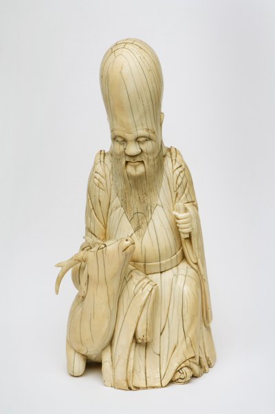 Figure en ivoire sculptée de Shou Xing assis avec un cerf, c.1580-1644 - Chinese School