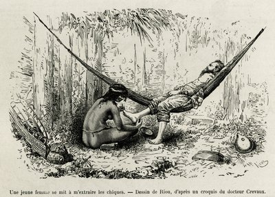 Une jeune femme Roucouyan extrait les échardes qui ont blessé les pieds de l