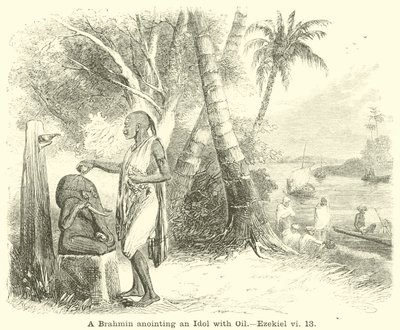 Un brahmane oint une idole avec de l