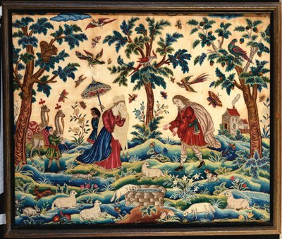 Une fine image en broderie de laine et de soie, probablement représentant la rencontre de Jacob et Rachel au puits - English School