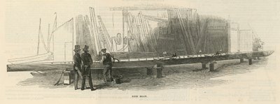 Deux hommes inspectent un nouveau bateau en construction - English School