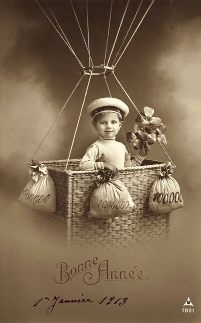 Carte de Nouvel An 1913, avec un garçon montant un ballon, avec beaucoup d