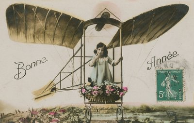 Carte de vœux de Nouvel An avec une fille dans un avion - French Photographer