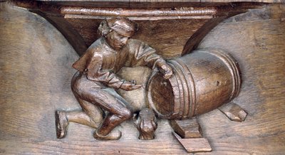 Sculpture représentant un homme mettant un robinet sur un tonneau, d