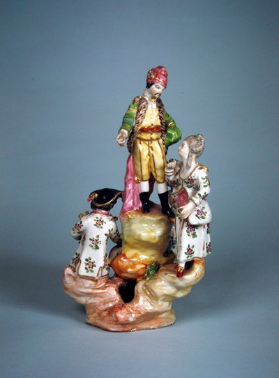 Statuette de quatre personnes groupées sur une rocaille (faïence) - French School