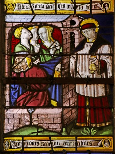 Vitrail représentant Saint Nicolas laissant de l